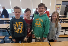 3rd graders building towers with marshmallows and spaghetti