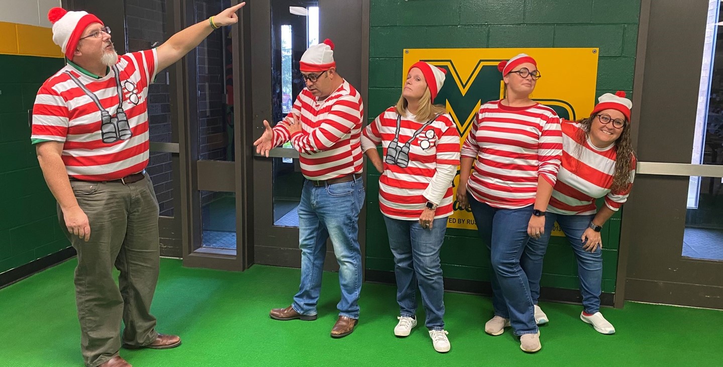The JH/HS front office staff dressed up at &#34;Where&#39;s Waldo&#34; for Halloween