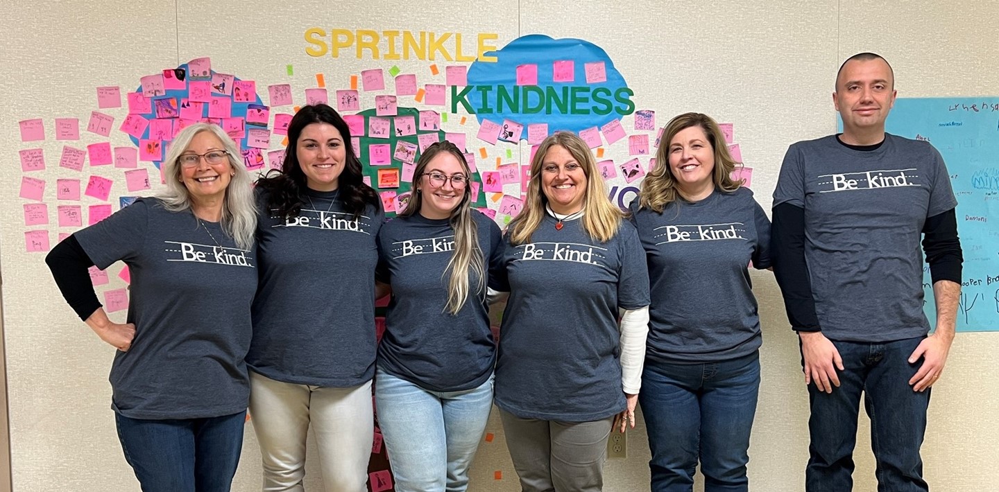 Teachers wearing Be Kind t-shirts during Kindness Week