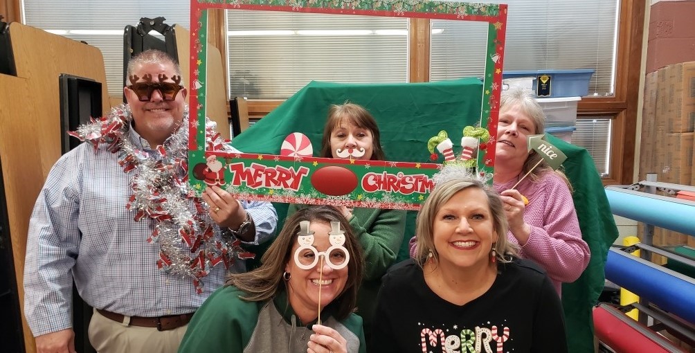 The office staff posing for a Christmas photo!