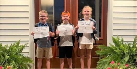 First day of school picture of three siblings