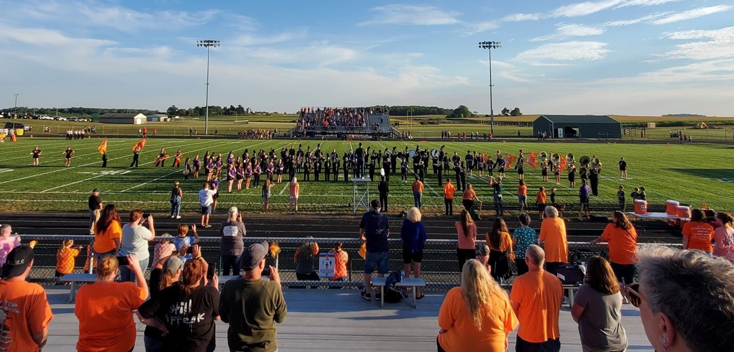 The band playing during halftime at the football game