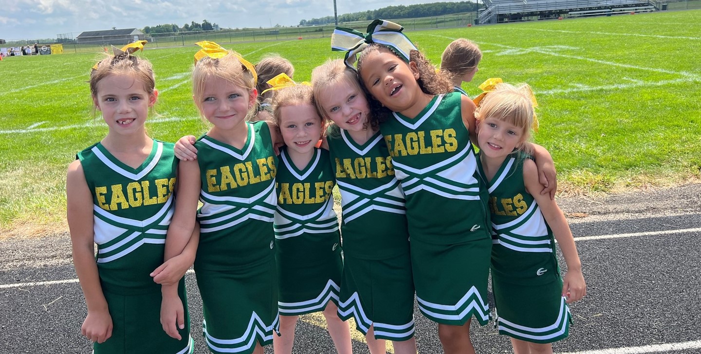 GEYSA cheerleaders huddled together in a pose