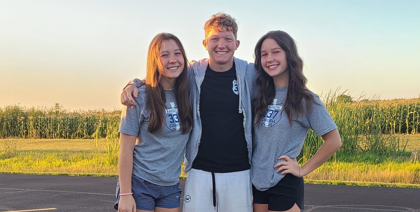 Siblings on the first day of school wearing shirts in memory of Mason Cordell